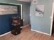 Inviting living room with modern floors, fish tank and a painting that add character to the home at 310 4Th Ave. Southwest, Ruskin, FL 33570