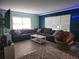 Open living area featuring comfortable sectional sofa, contemporary lighting, and lots of natural light at 310 4Th Ave. Southwest, Ruskin, FL 33570