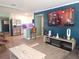 Open concept living space with large kitchen island and TV at 310 4Th Ave. Southwest, Ruskin, FL 33570