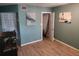 Inviting living room with modern floors, a fish tank, and doors leading to other rooms of the home at 310 4Th Ave. Southwest, Ruskin, FL 33570