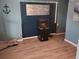 Inviting living room with modern floors, fish tank and nautical decorations that add character to the home at 310 4Th Ave. Southwest, Ruskin, FL 33570