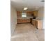 Kitchen features wooden cabinets, white countertops and stainless steel microwave at 3111 S Canal Dr, Palm Harbor, FL 34684