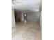 Open concept living room with tile flooring and neutral paint at 3111 S Canal Dr, Palm Harbor, FL 34684