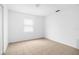 Bright bedroom features tile flooring and neutral paint at 312 E Tomlin St, Plant City, FL 33563