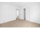 Bedroom features tile flooring, closet, and neutral paint at 312 E Tomlin St, Plant City, FL 33563