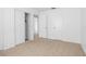Bright bedroom features tile flooring, closet and neutral paint at 312 E Tomlin St, Plant City, FL 33563