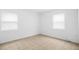 Well-lit bedroom features tile flooring and neutral paint at 312 E Tomlin St, Plant City, FL 33563