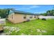 Exterior view of home with well-maintained backyard and landscaping at 312 E Tomlin St, Plant City, FL 33563
