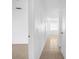Bright hallway with neutral tile flooring and paint at 312 E Tomlin St, Plant City, FL 33563