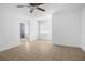 Bright, open-concept living area featuring neutral tile floors and seamless flow at 312 E Tomlin St, Plant City, FL 33563
