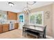 Cozy dining area with table, chairs, chandelier, and a door leading outside at 3129 W Villa Rosa St, Tampa, FL 33611