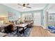 Bright living room with hardwood floors, comfortable couches, and a charming nautical-themed rug at 3129 W Villa Rosa St, Tampa, FL 33611
