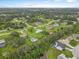 Picturesque aerial view of a residential neighborhood with lush green trees at 3515 E 34Th St, Bradenton, FL 34208