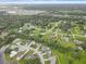 Picturesque aerial view of a residential neighborhood with lush green trees at 3515 E 34Th St, Bradenton, FL 34208