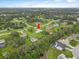 Aerial view of a tree-lined neighborhood with spacious yards and serene ponds, capturing a tranquil community at 3515 E 34Th St, Bradenton, FL 34208
