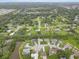 Picturesque aerial view of a residential neighborhood with lush green trees at 3515 E 34Th St, Bradenton, FL 34208