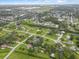 Picturesque aerial view of a residential neighborhood with lush green trees at 3515 E 34Th St, Bradenton, FL 34208