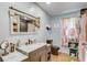 Bathroom featuring vanity, decorative accents, and tile floors at 3515 E 34Th St, Bradenton, FL 34208