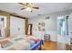 Bedroom with a barn door, dresser, and wood-look floors at 3515 E 34Th St, Bradenton, FL 34208