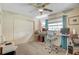 Bedroom featuring a ceiling fan, window, closet and carpet at 3515 E 34Th St, Bradenton, FL 34208