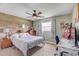 Bedroom featuring wood accent wall and natural light at 3515 E 34Th St, Bradenton, FL 34208