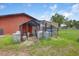 Exterior shot of chicken coops on the property with grass at 3515 E 34Th St, Bradenton, FL 34208