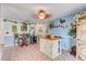 Cozy dining area with a small island, wine rack, and tile flooring at 3515 E 34Th St, Bradenton, FL 34208