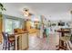 Open-concept dining area with tile flooring, natural light, and ample space at 3515 E 34Th St, Bradenton, FL 34208