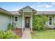 Inviting front entrance with a decorative wreath and charming outdoor lighting at 3515 E 34Th St, Bradenton, FL 34208