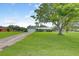 Charming single-story home with attached garage and large front yard at 3515 E 34Th St, Bradenton, FL 34208