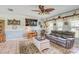 Cozy living room featuring a ceiling fan, natural light and comfortable seating at 3515 E 34Th St, Bradenton, FL 34208