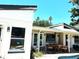 Beautiful covered patio with outdoor seating, perfect for entertaining and relaxation at 3811 Huntington Ne St, St Petersburg, FL 33703