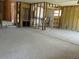 Spacious living room featuring exposed framing, ready for customization and renovation at 3811 Huntington Ne St, St Petersburg, FL 33703
