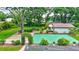The backyard includes lush greenery, a sport court, and a peaceful ambiance at 3923 Hudson Ln, Tampa, FL 33618
