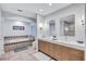 Bright bathroom with tub, walk-in shower, double sink vanity, and a modern design at 3923 Hudson Ln, Tampa, FL 33618