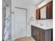 This bathroom features a large vanity, updated mirror, shower with updated tile and a linen closet at 3923 Hudson Ln, Tampa, FL 33618