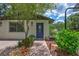 Attractive home exterior featuring a decorative front door and well-manicured landscaping at 3923 Hudson Ln, Tampa, FL 33618