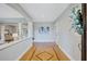 Inviting foyer with hardwood floors, decorative inlay, and neutral wall colors at 3923 Hudson Ln, Tampa, FL 33618