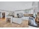 Beautiful, bright kitchen with stainless steel appliances, island, granite countertops, and tile floors at 3923 Hudson Ln, Tampa, FL 33618