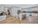 Spacious kitchen with white cabinets, granite countertops, tile flooring and stainless steel appliances at 3923 Hudson Ln, Tampa, FL 33618