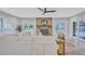 Bright living room with tile flooring, fireplace, and french doors leading to outdoor pool at 3923 Hudson Ln, Tampa, FL 33618