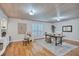 Office with hardwood floors, wainscoting, shutters, and bright, neutral color scheme at 3923 Hudson Ln, Tampa, FL 33618