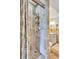 Bathroom shower with tiled surround and bronze showerhead, with view of the vanity at 3923 Hudson Ln, Tampa, FL 33618