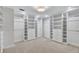 Spacious walk-in closet with custom shelving and drawers for optimal storage at 3923 Hudson Ln, Tampa, FL 33618