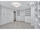 Well-organized walk-in closet featuring custom cabinets and built-in shelving at 3923 Hudson Ln, Tampa, FL 33618