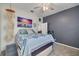 Bedroom featuring ceiling fan, stylish furnishings and closet at 4147 Grandchamp Cir, Palm Harbor, FL 34685