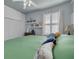 Bright bedroom with large window, and closet at 4147 Grandchamp Cir, Palm Harbor, FL 34685