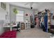 Bright bedroom with modern furnishings, desk, and closet space at 4147 Grandchamp Cir, Palm Harbor, FL 34685