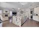 Spacious kitchen and living room featuring an island with a granite countertop and stainless steel appliances at 4147 Grandchamp Cir, Palm Harbor, FL 34685