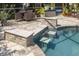 Inviting pool with unique stepped entry and plenty of space for seating at 4147 Grandchamp Cir, Palm Harbor, FL 34685